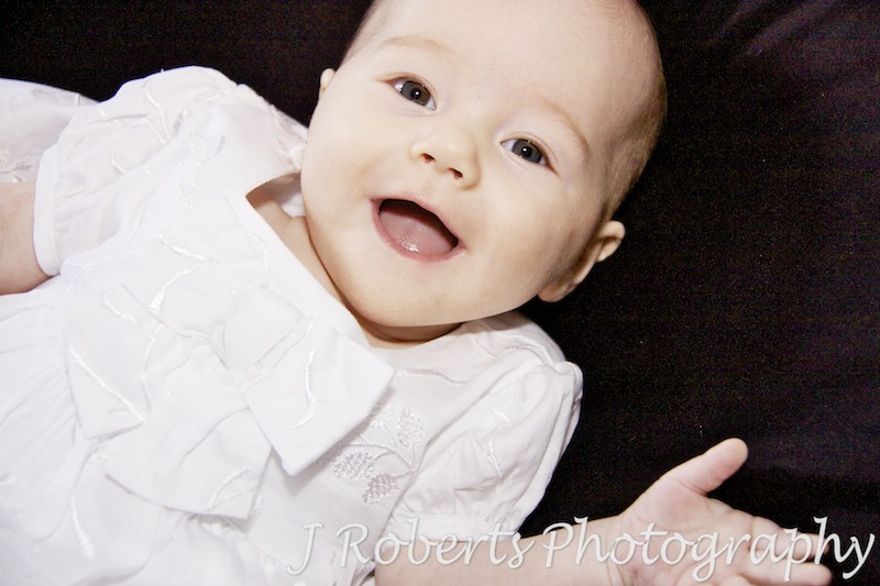 Baby girl in her christening dress - baby portrait photography sydney